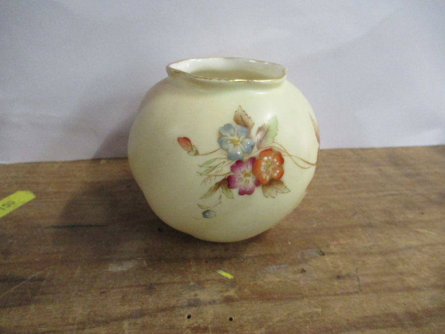 A Royal Worcester blush ivory squat vase, decorated with flowers