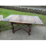 An oak draw leaf table fully extending 72ins, width 42ins, together with a smaller extending