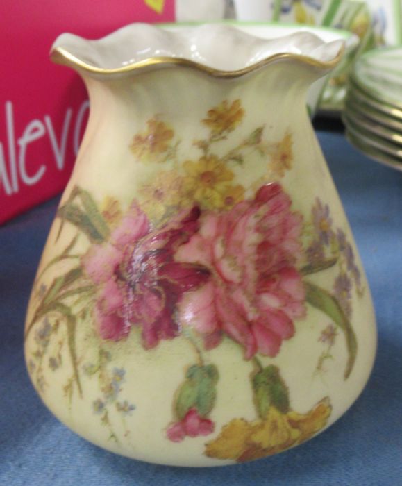 A Royal Worcester blush ivory vase, decorated with flowers, shape number G957