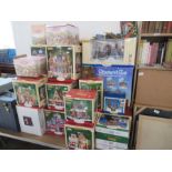 A large collection of boxed Lemax ornaments and other boxed ornaments