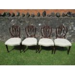 A set of four 19th century design dinning chairs having shield back with fleur de lis decoration