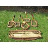Five vintage tennis rackets and cricket bag