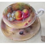 An unmarked Royal Worcester cup, decorated to the interior and exterior with fruit to a mossy