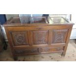 An Antique oak mule chest, with carved decoration to the front, fitted two drawers, 47.5ins x 20.