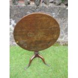 A 19th century Oak tilt top tripod table, diameter 30ins