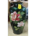 A cloisonne case, decorated with flowers to a green ground, height 6.5ins