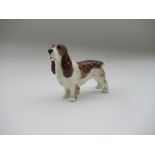 A Royal Worcester model, of a Liver and white Spaniel, Shape No 3033, height 2.75ins