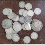 A collection of coins, to include shillings
