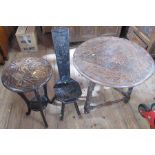 A circular carved drop flap table, diameter 28ins, together with a carved milking chair and a carved