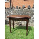 A 19th century mahogany fold over table width 32ins, height 28ins