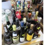 A large collection of alcohol to include wines, champagne and spirits