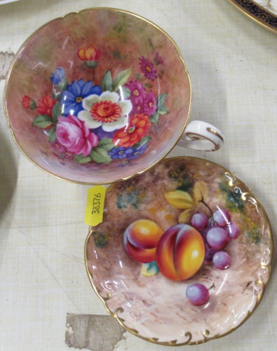 A Royal Worcester cup, the interior decorated with flowers by Barker, together with a Royal