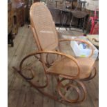 A bentwood and cane rocking chair