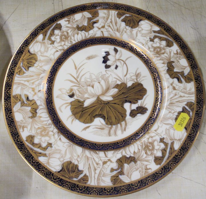 A Royal Worcester plate, decorated with a lily and pad, diameter 10.5ins