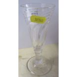An Antique drinking glass with wrythern bowl, height 5.75ins