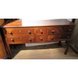 An Antique oak dresser base, fitted with two banks of three drawers, 58.5ins x 18ins, height 33ins