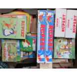 Two boxes of Rupert Bear books, board games etc