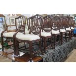 A set of 12 (10+2) reproduction mahogany dining chairs with carved decoration  - no fire lables