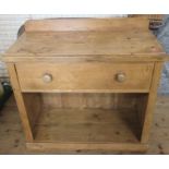 An Antique pine side table, fitted with a frieze drawer with shelf under, 35ins x 17ins, height 31.