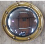 A gilt framed circular convex mirror, overall diameter 18.75ins