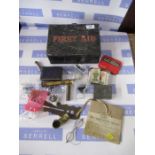 A First Aid tin and contents, including Douglas Combined protractor and rule, coins, pewter box with