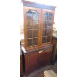 A mahogany cabinet, with glazed upper section and cupboard to the base