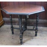 A late Victorian Gillows & Co octagonal centre table, with burr wood and chequer banding to the top,