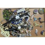 A collection of costume jewellery, to include two wrist watches, brooches, necklaces etc