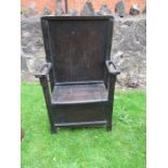 An ebonized Art Nouveau seat seattle, width 25ins, height 42ins, depth 12ins