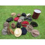 A collection of hats, including bowler, vintage children's riding hats, a Herbert Johnson hat box
