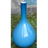 A blue glass bottle, height 16ins