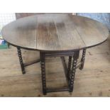 An Antique oak gateleg table, on bobbin turned supports, 44ins x 34ins, height 26.75ins