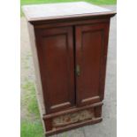 A mahogany cupboard, fitted with a pair of doors over a drawer, width 27ins, depth 27ins, height