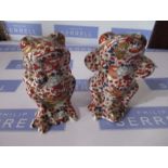 A pair of Oriental style model frogs, decorated in the Imari palette, height 5ins