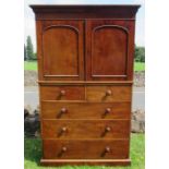 A Victorian mahogany linen press cupboard, the upper section fitted with slides, the base with