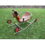 A Rupert Bear rocking chair, with wheels, together with a scooter