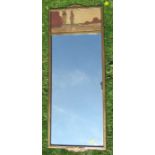 A gilt framed rectangular wall mirror, the upper section with marquetry landscape in specimen woods,