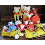 A collection of Rupert Bear soft toy, models, poster, print and laundry basket