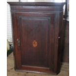 An Antique oak corner cupboard, with inlaid decoration to the door, height 43ins