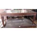 A mahogany rectangular coffee table, with tooled leather top, 36ins x 19ins, height 16ins