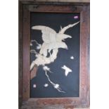 A framed Oriental shibayama panel, of birds, in bone, overall 28.75ins x 19ins