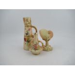 Three pieces of Royal Worcester blush ivory, to include a claret jug, a shell centre piece and a two