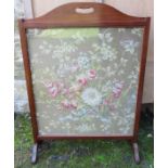 An Edwardian mahogany fire screen, with fabric panel, 36ins x 26ins