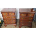 A pair of reproduction mahogany bedside chests, with cross banding and fitted with drawers, width