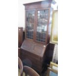 An oak bureau bookcase, width 30ins, height 79ins