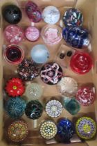 A collection of glass paperweights