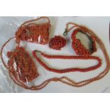 A collection of coral jewellery, to include necklaces, a brooch and a bangle