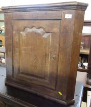 An Antique oak corner cupboard, width 26.5ins, height 26ins, depth 14.5ins