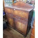 A 19th century mahogany secretaire cabinet, the fall flap fitted with a writing surface, drawers and