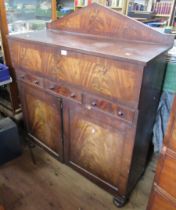A 19th century mahogany secretaire cabinet, the fall flap fitted with a writing surface, drawers and
